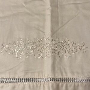 Valance, white embroidery details. 84” x 18”
